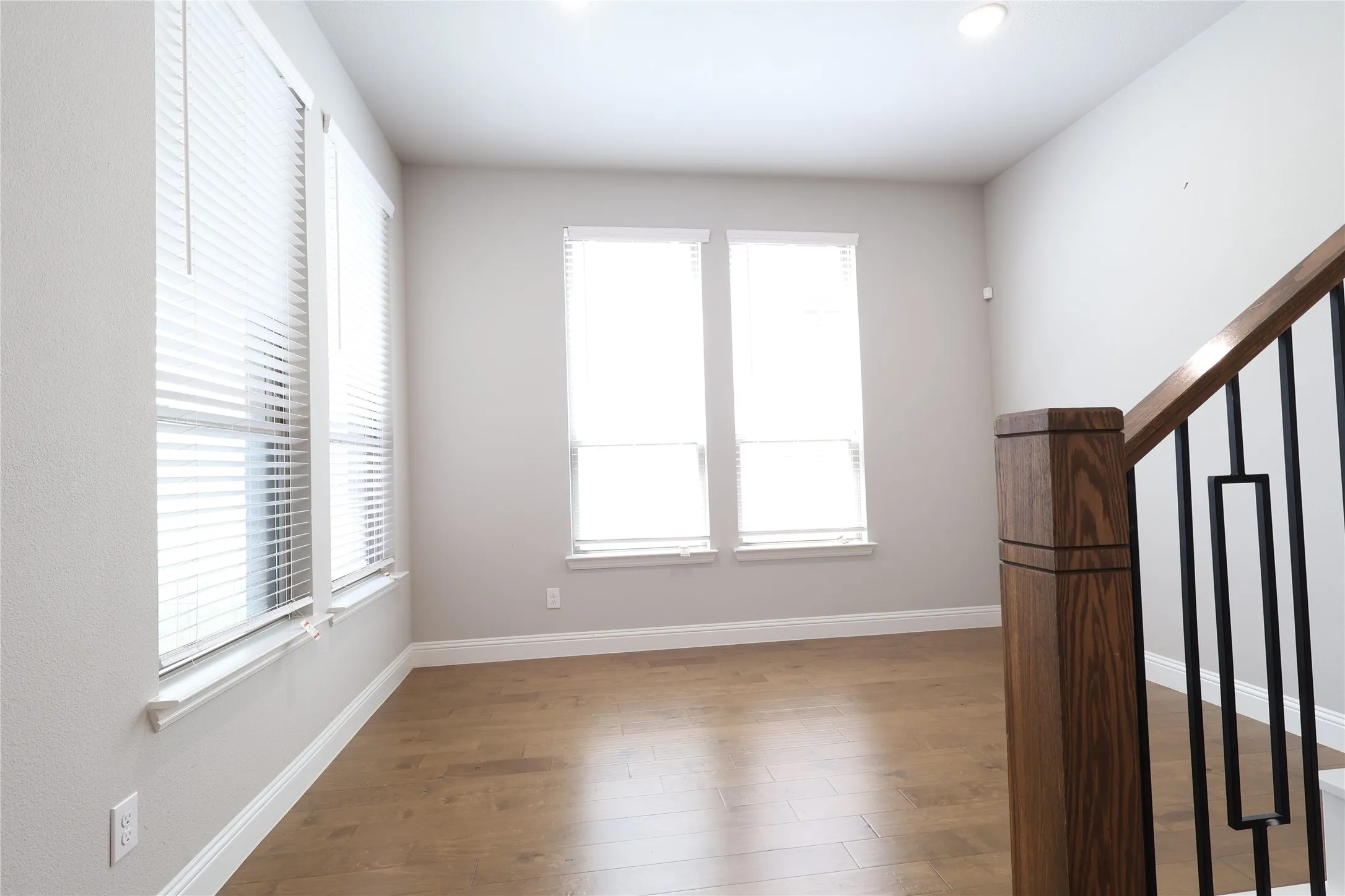 Empty room featuring wood finished floors and baseboards