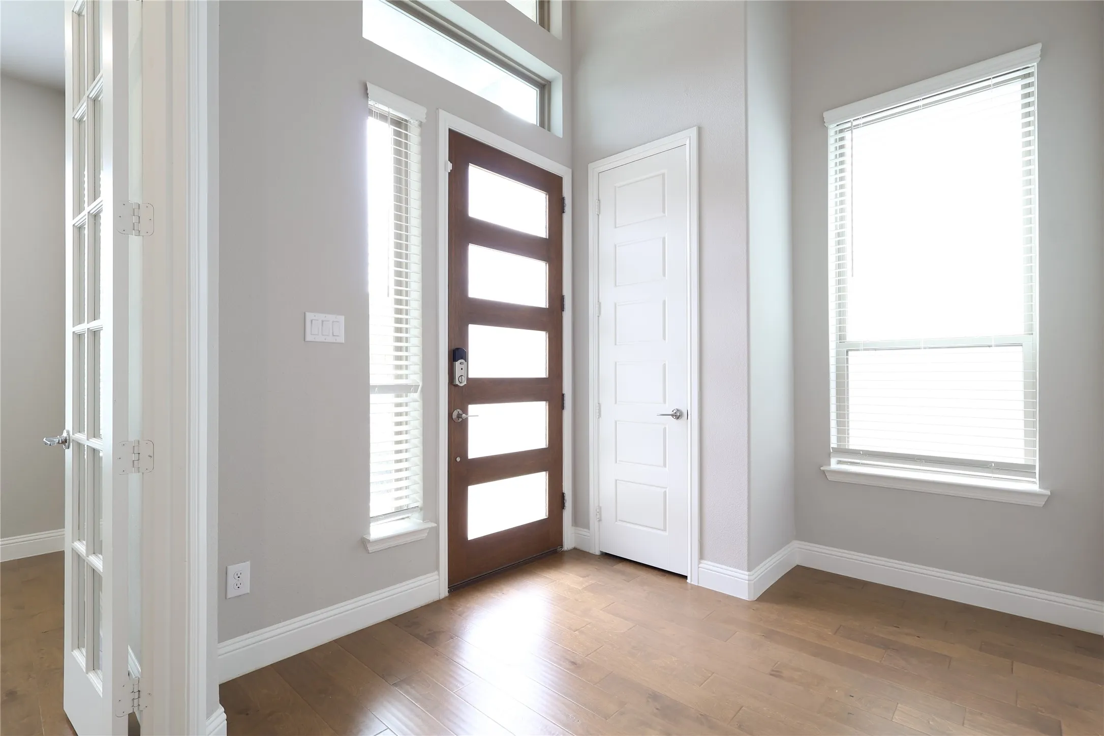 Foyer featuring wood finished floors and baseboards