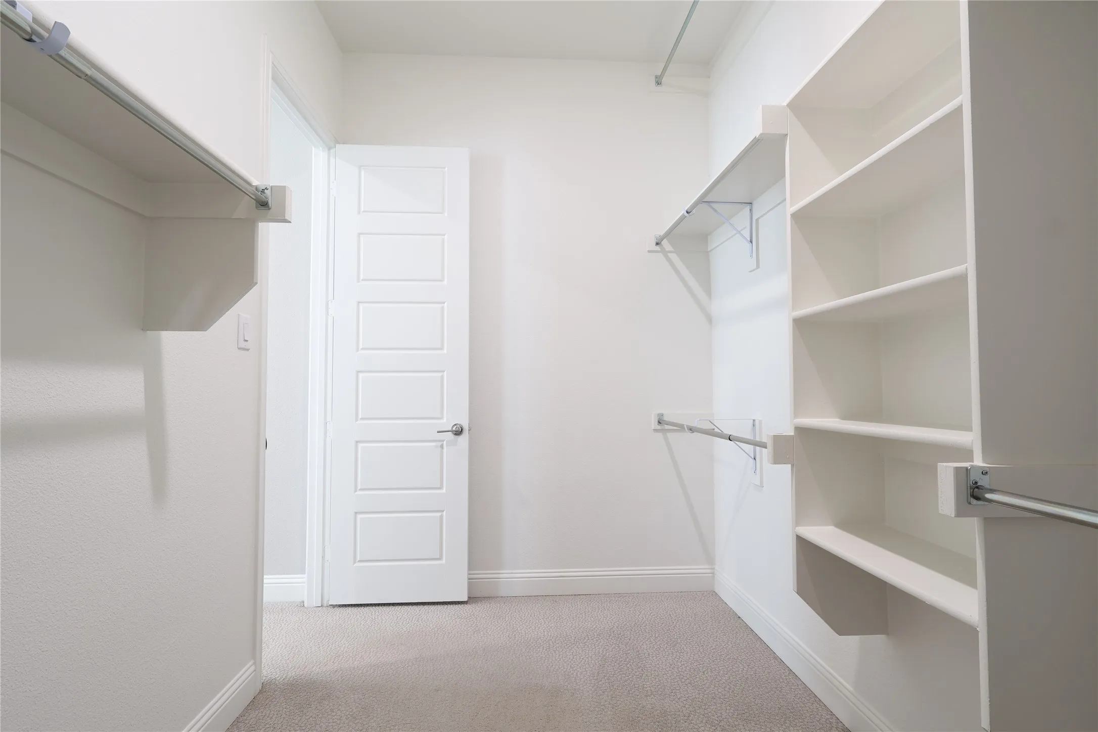 Spacious closet with carpet
