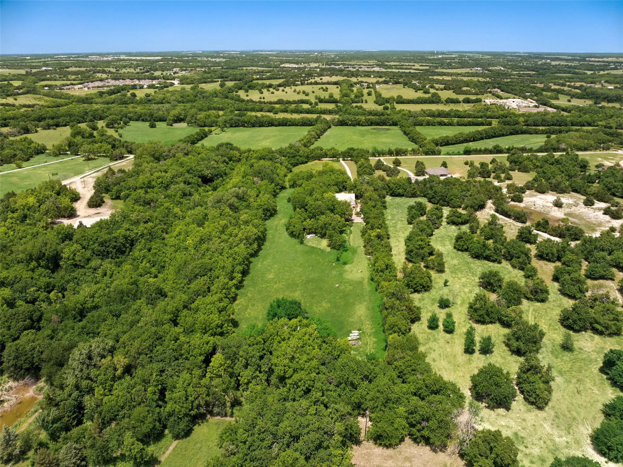 Breathtaking 16+ Acre Oasis in Nature, Surrounded by Towering Pines, Majestic Pecan Trees, and More – Your Private Retreat Awaits!