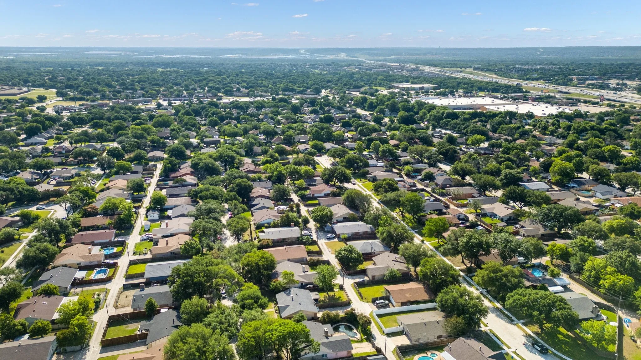 View of property location featuring nearby suburban area