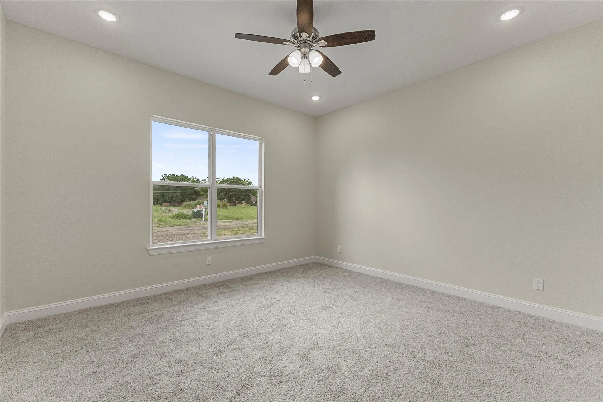 Unfurnished room with recessed lighting, carpet, and ceiling fan