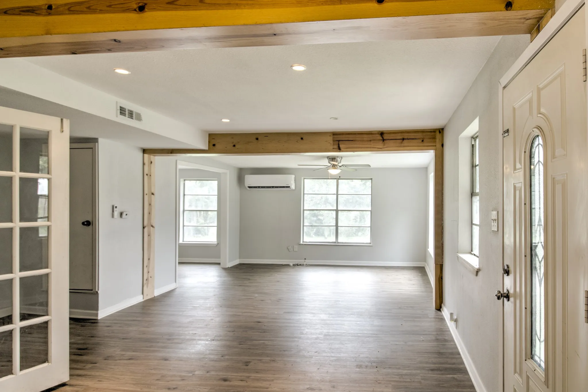 Entry into the home, featuring beautiful wooden beams!
