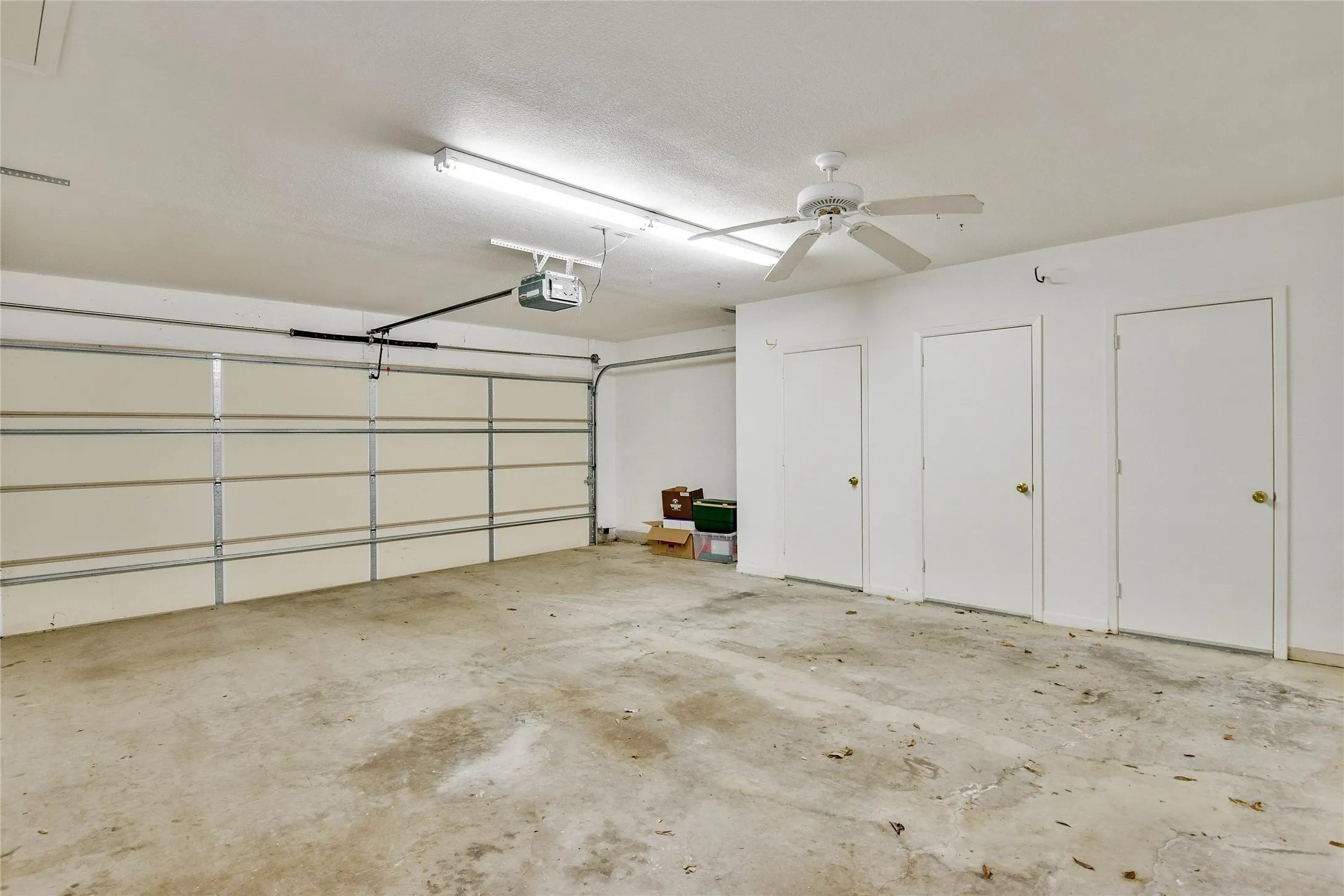 Garage featuring a garage door opener