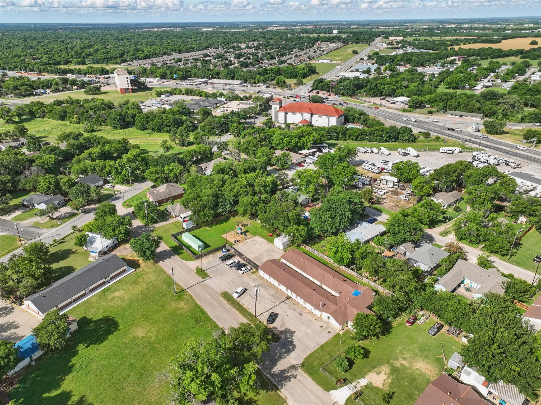 Aerial overview of property's location with nearby suburban area