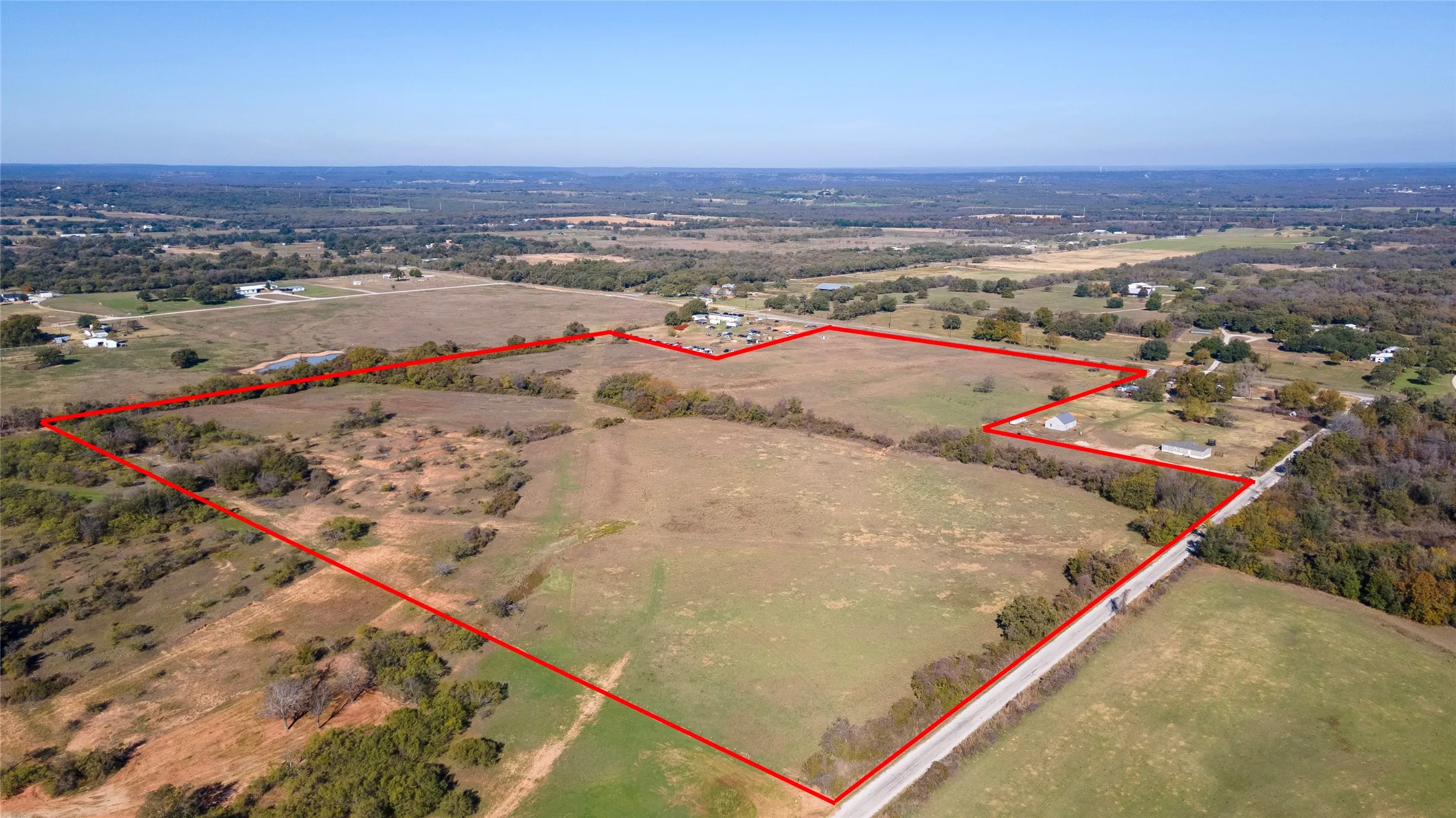 Overview of rural landscape featuring property parcel outlined