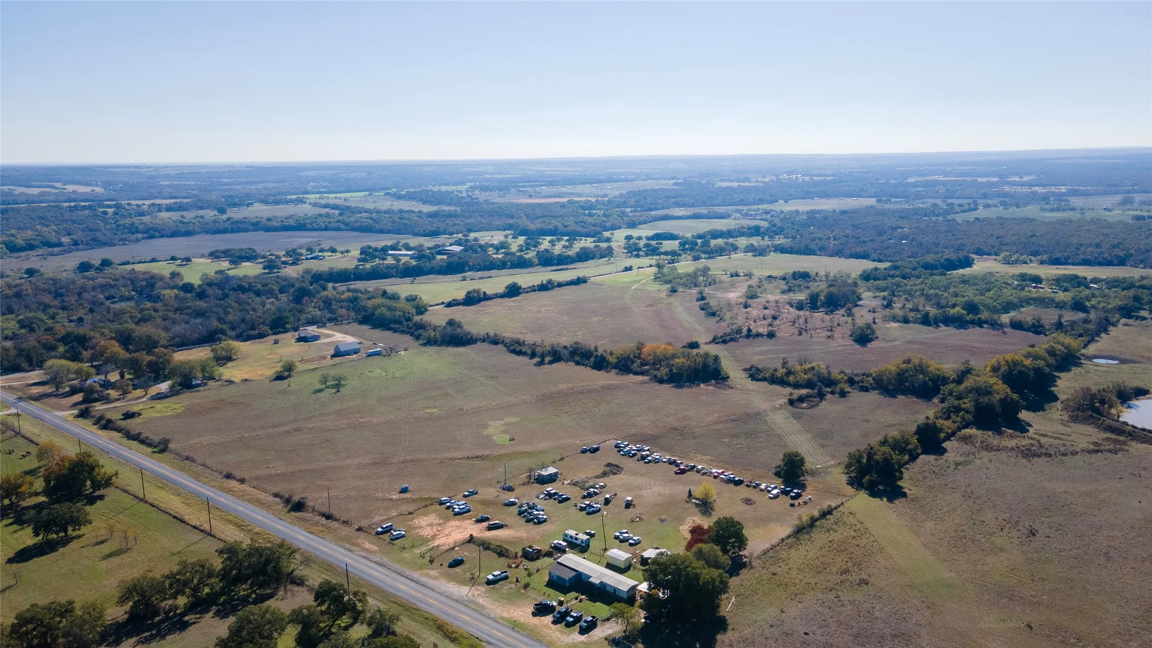 Aerial overview of property's location featuring rural landscape