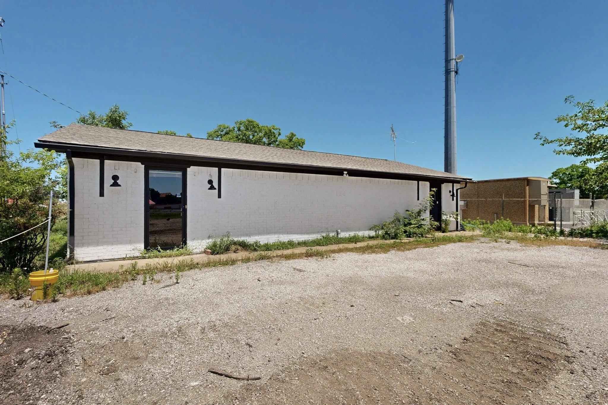 View of property exterior with brick siding