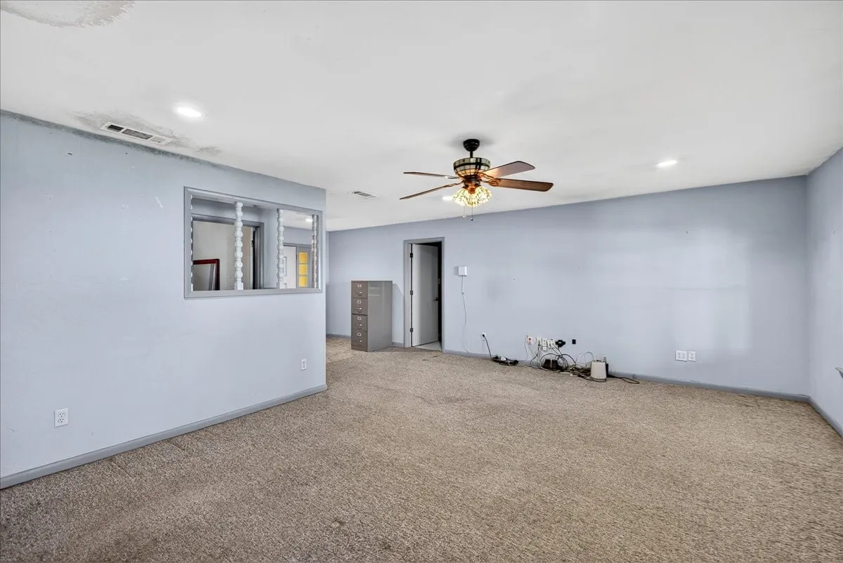 Spare room with carpet, ceiling fan, and recessed lighting