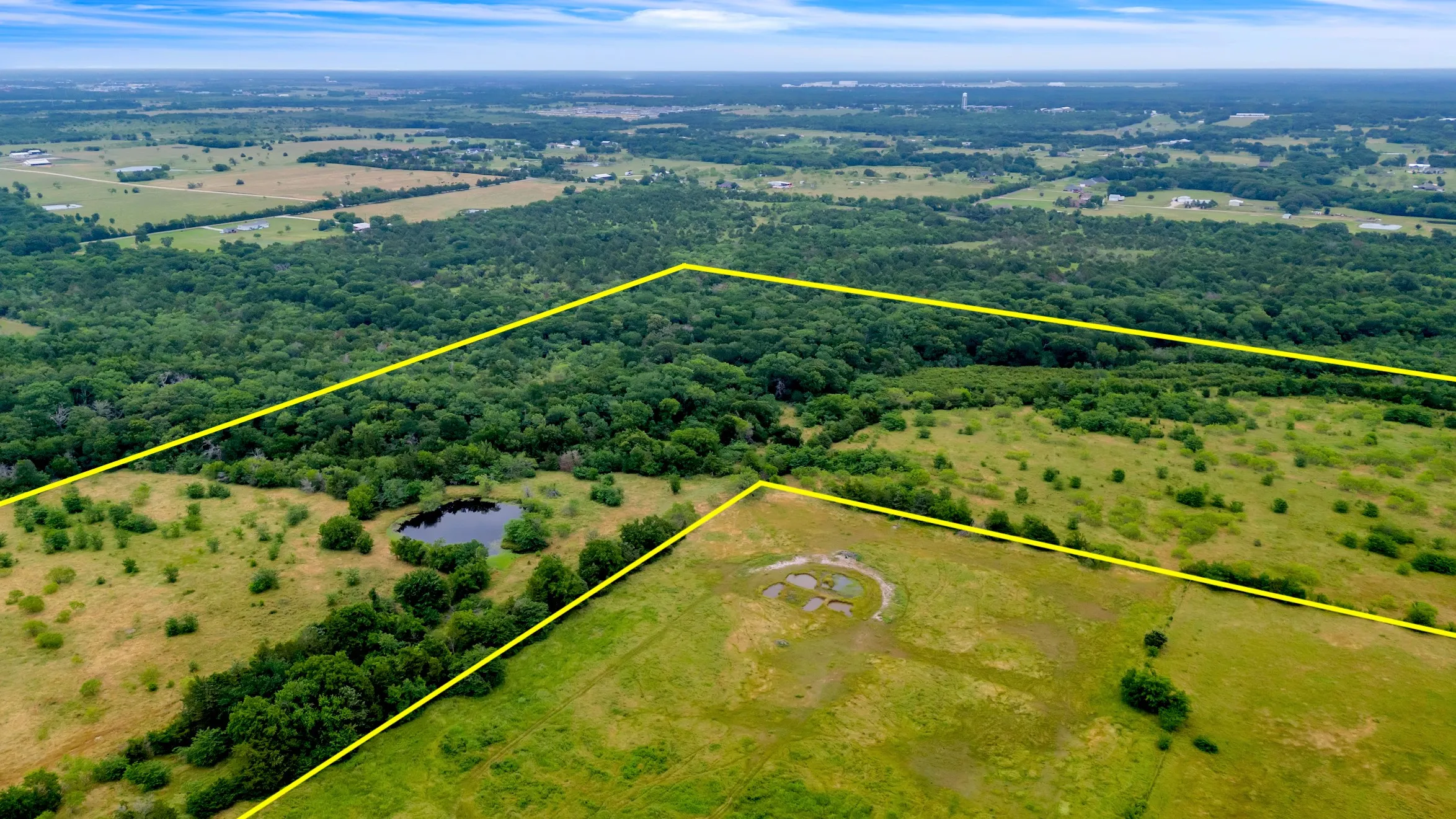 Aerial overview of property's location featuring property boundaries highlighted