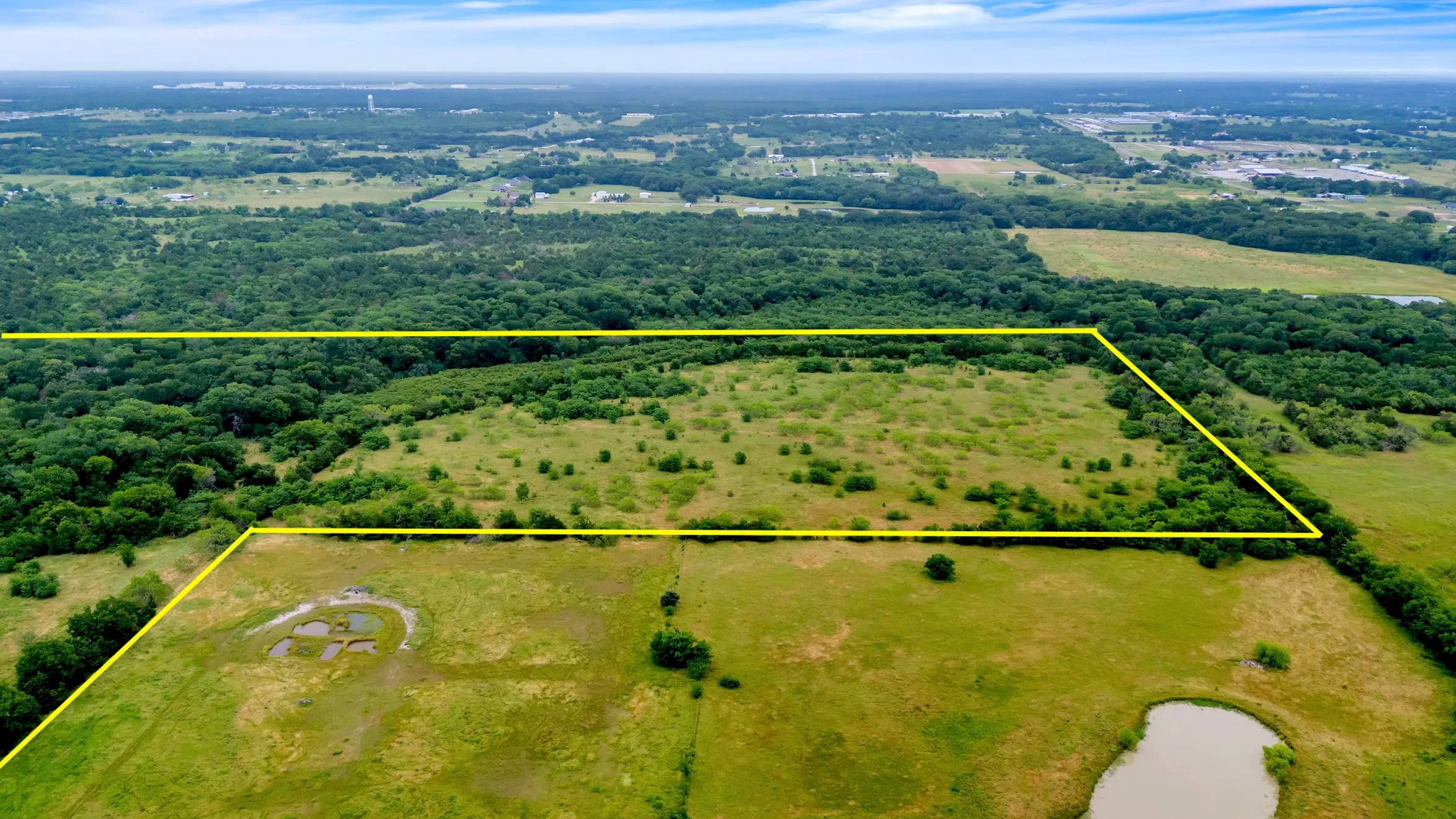 Aerial view of property's location with property parcel outlined