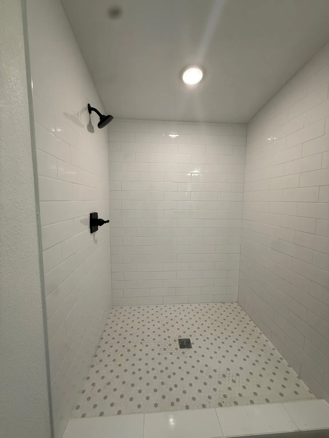 Bathroom featuring a shower stall