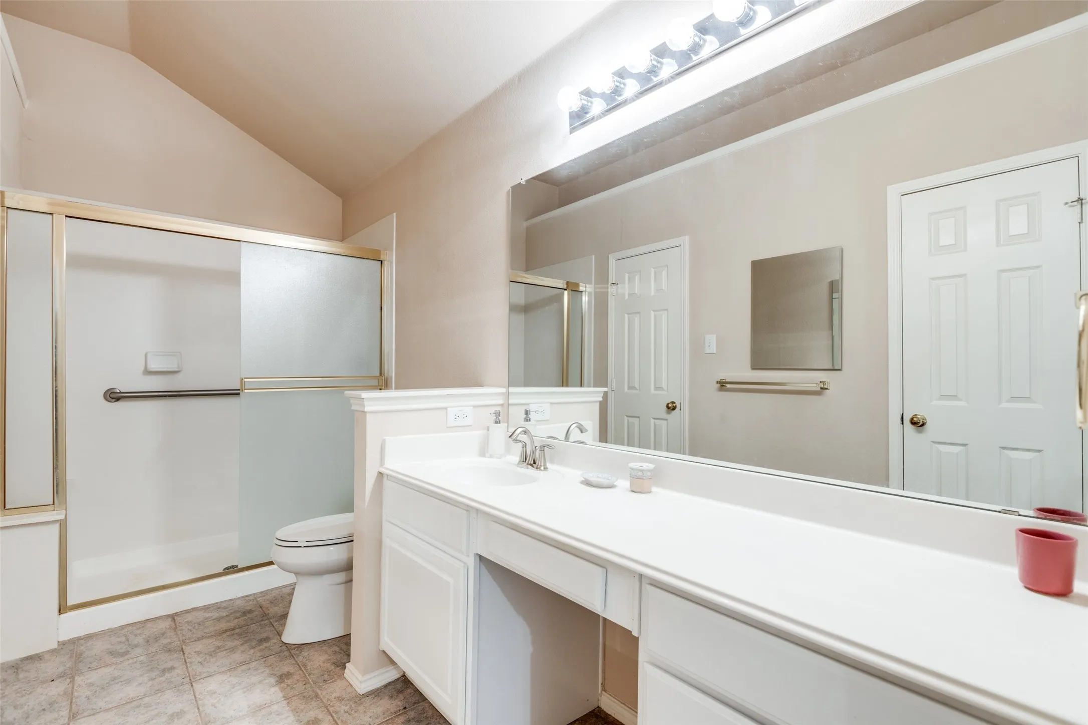Fantastic picture of the master, primary bath.  Knee space where you can sit down and apply your make-up.  Easy access walk in shower.  Mirror door on accessible medicine cabinet between generous walk in closet with two doors.