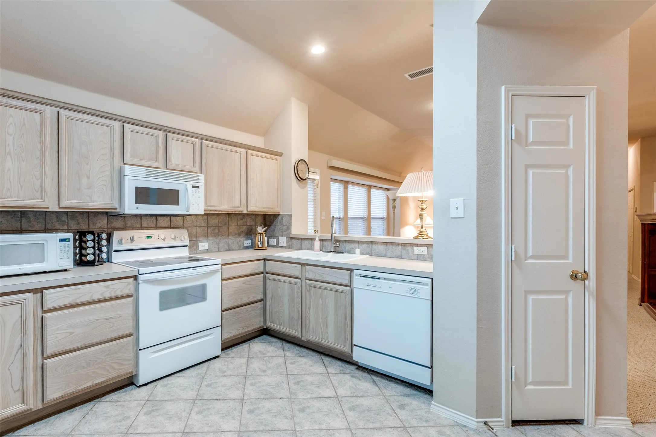 Ready for the cook.  Lots of cabinets, drawers and counter space.  This eat in kitchen is at the front of your new home.