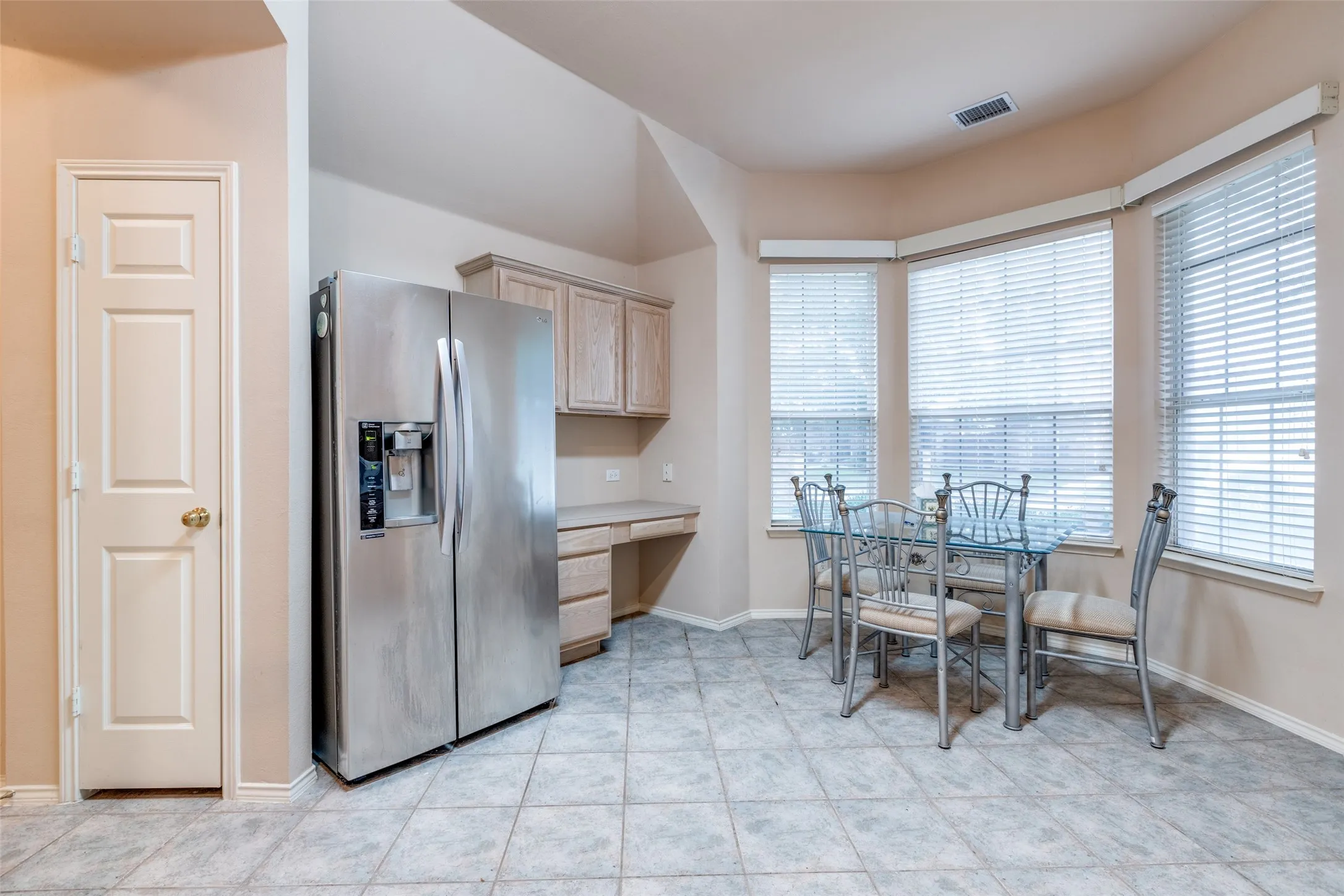 Yes, the refrigerator remains and maybe even the perfect size table and chairs.  Note the planning desk and the pantry.  Enjoy your meal and watch your neighbors, both man and beast, stroll by.