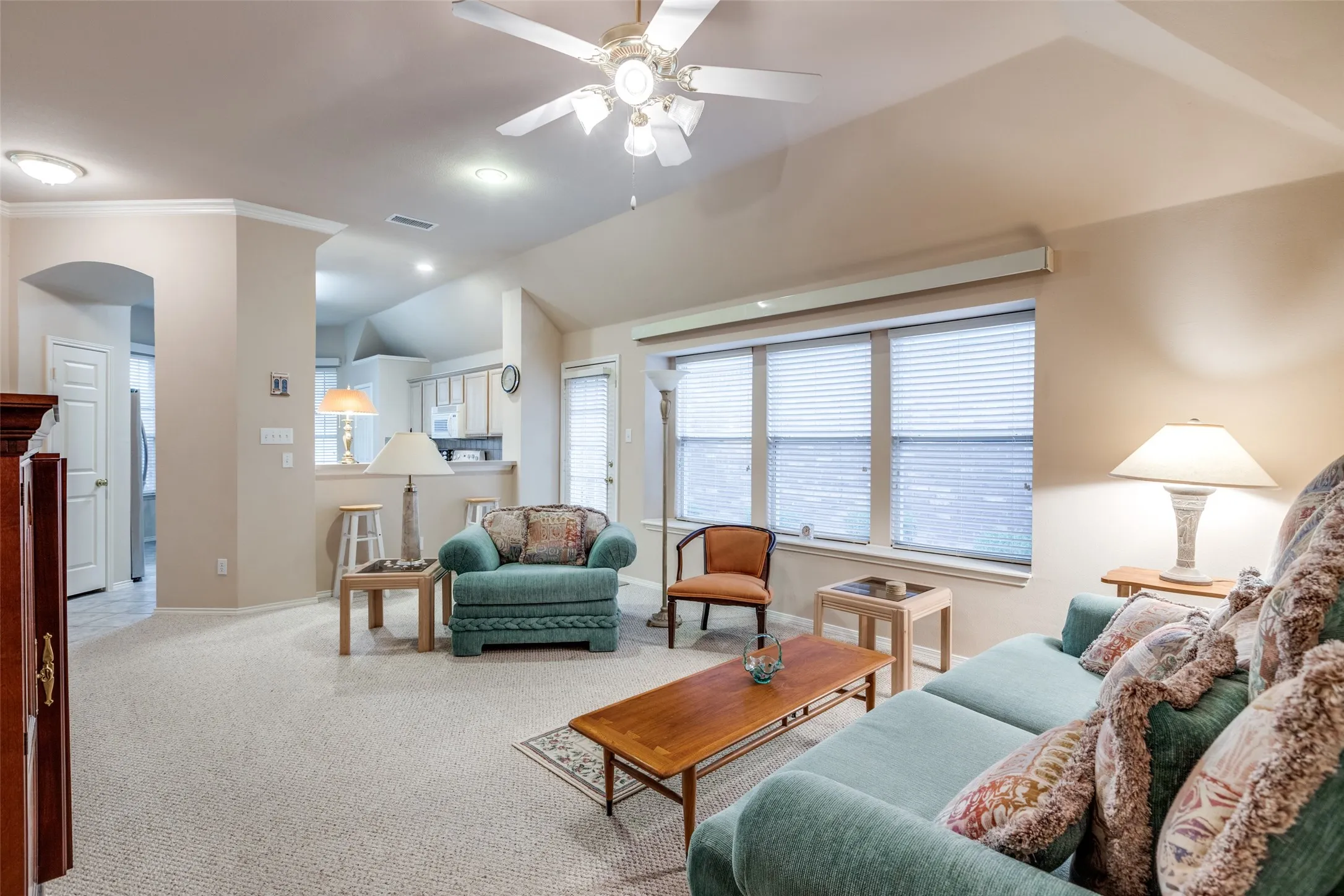 Enjoy this larger living area complete with furniture if the price is right.  Wood window blinds, ceiling fan. Lots of privacy.