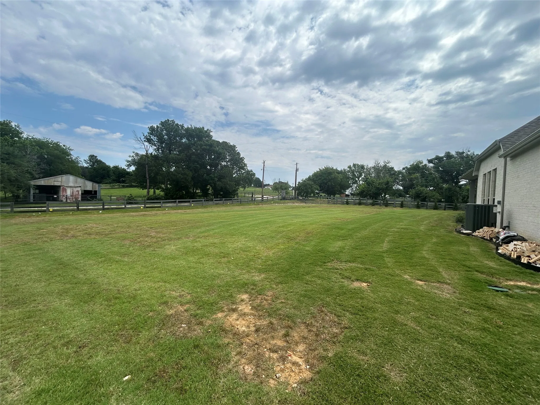 View of yard with cooling unit