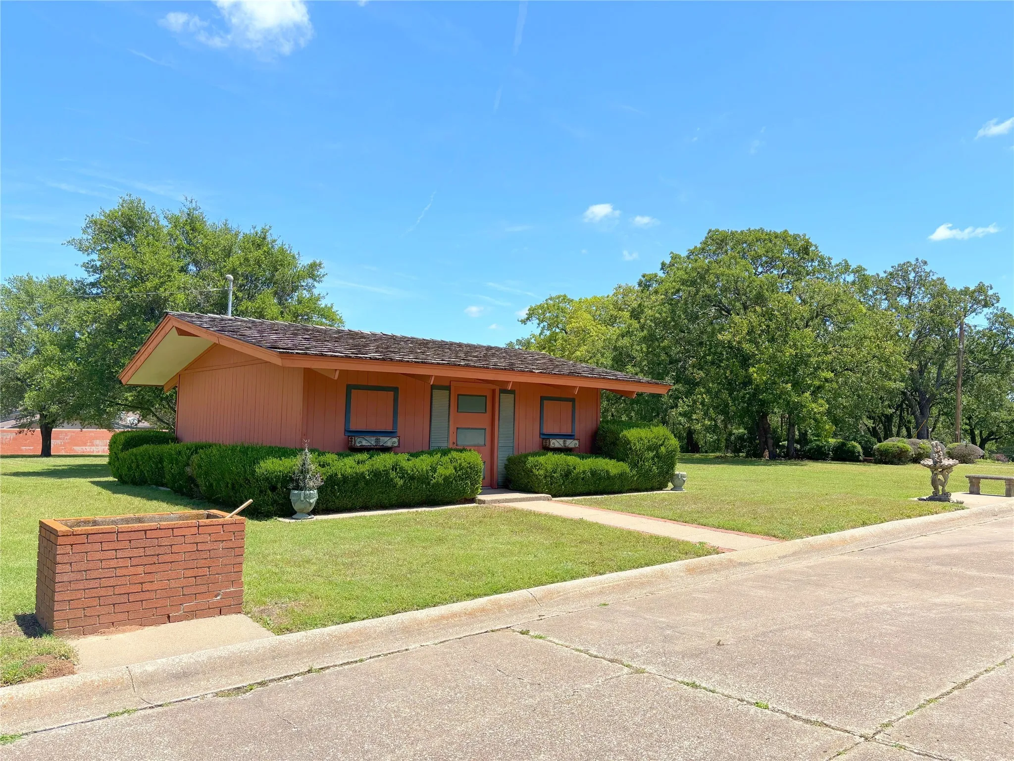 View of front of house with a front lawn and covered porch