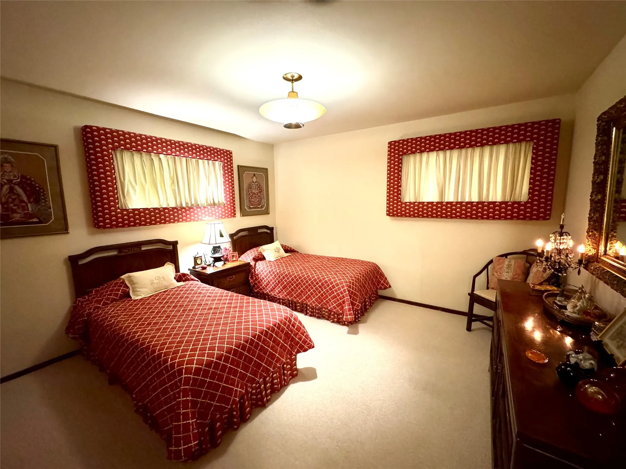 Carpeted bedroom featuring baseboards
