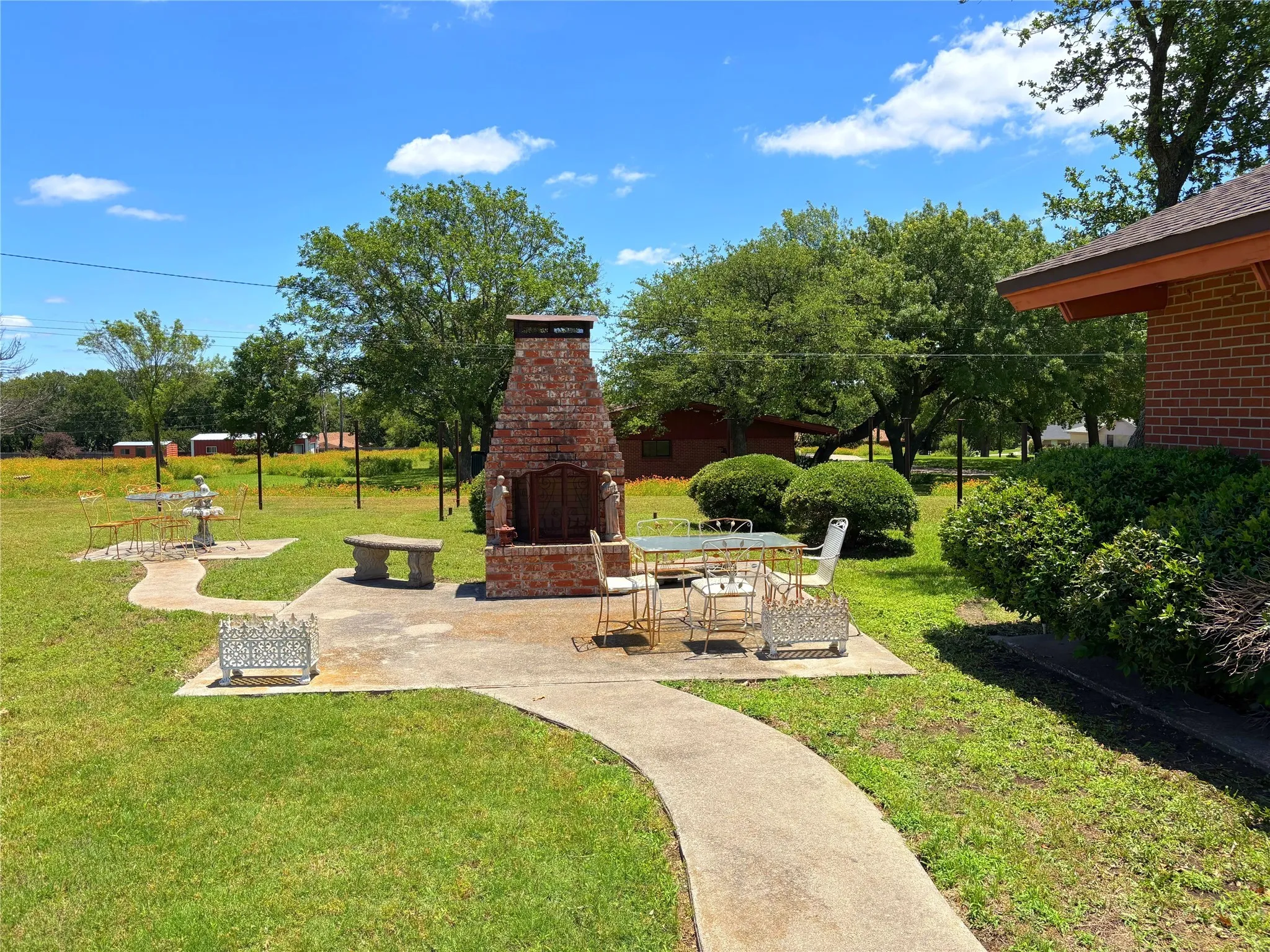 View of property's community featuring a patio area and a yard