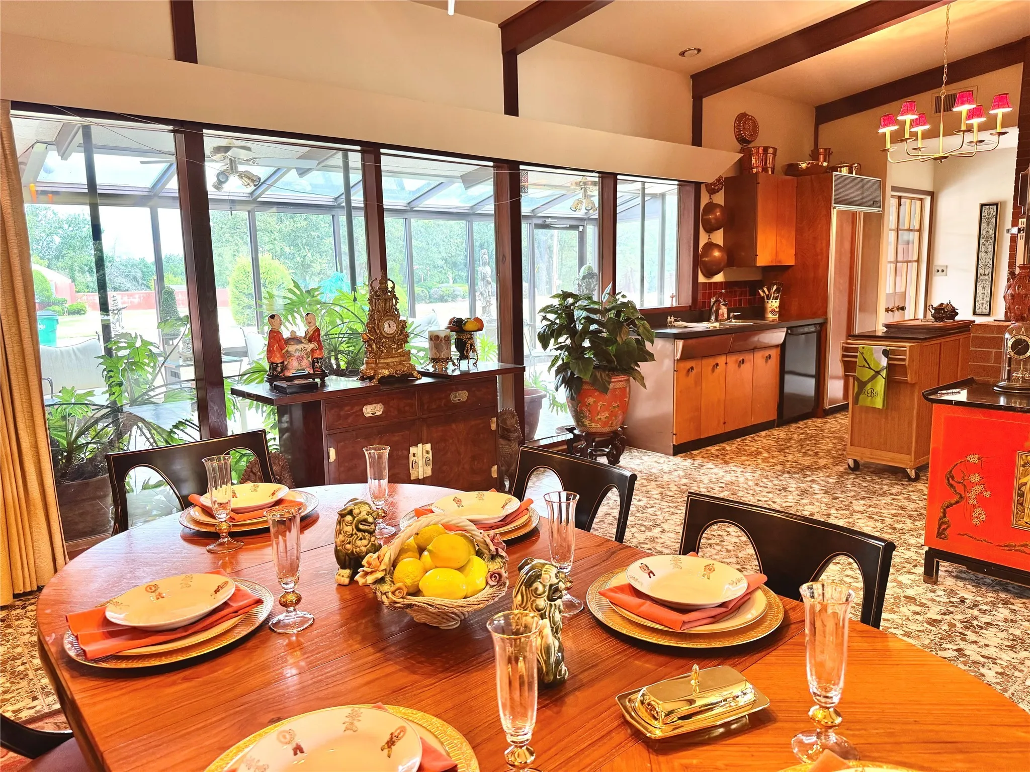 Dining space featuring beam ceiling and a chandelier