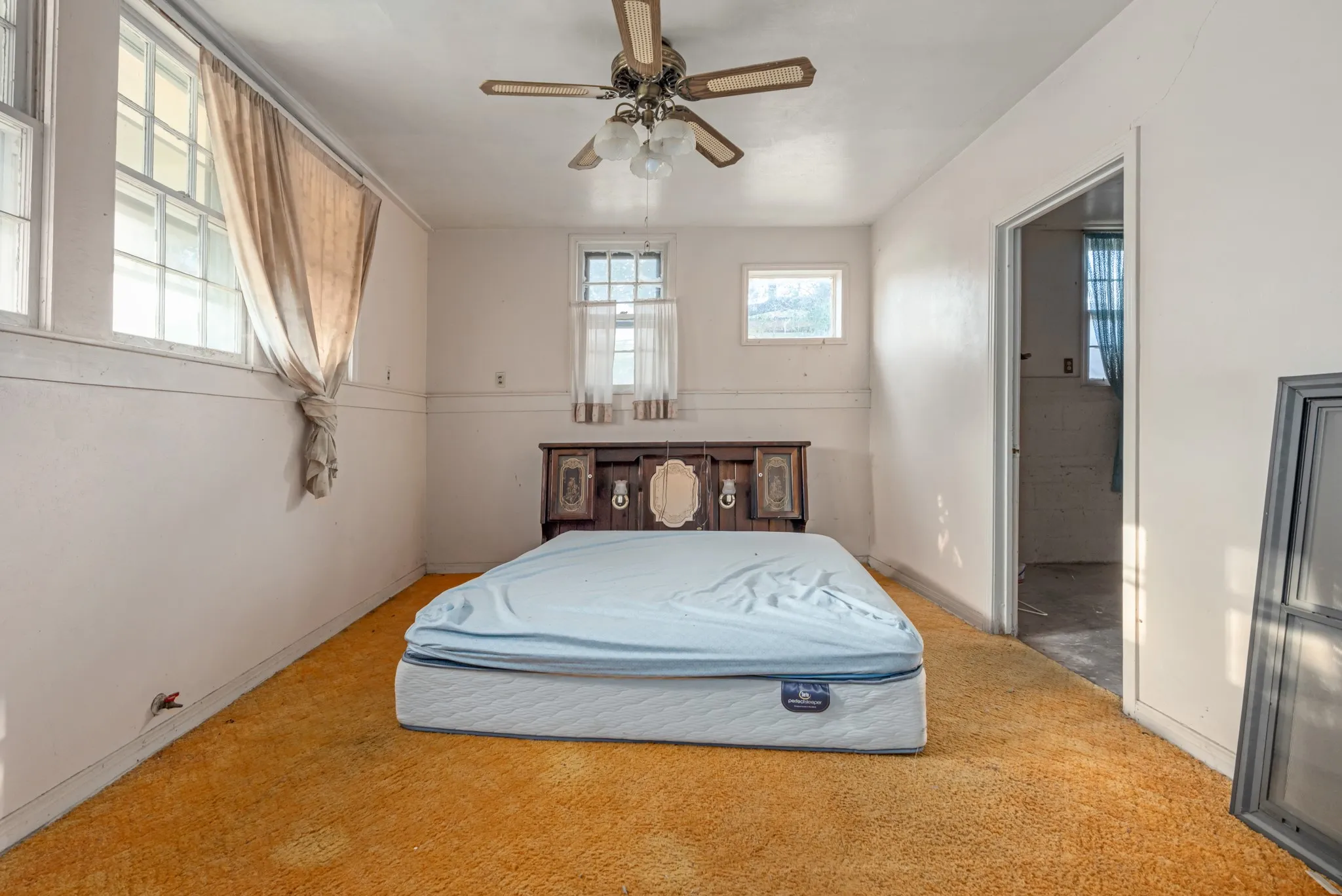 Bedroom with carpet and a ceiling fan