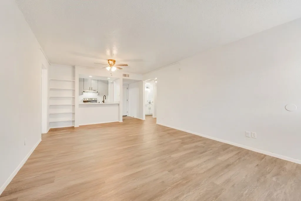VIEW OF THE DINING AREA AND LIVING ROOM
