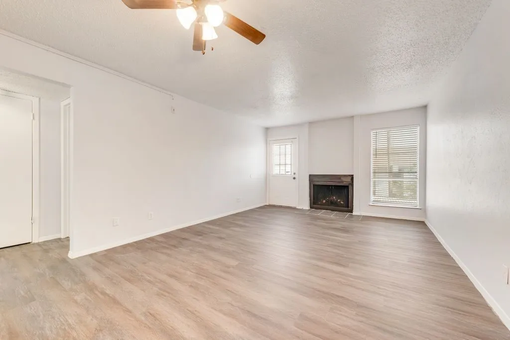 LIVING ROOM WITH WOOD-BURNING FIREPLACE