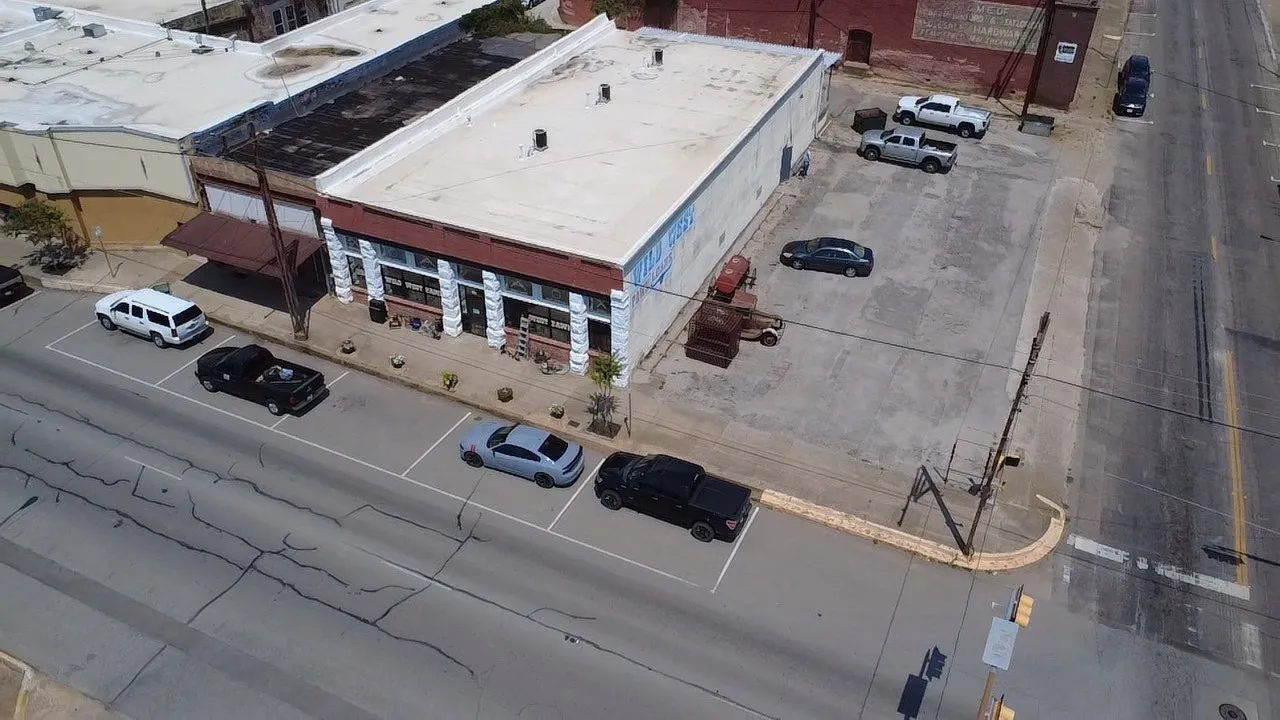 parking lot is separate deeded parcel included in sale