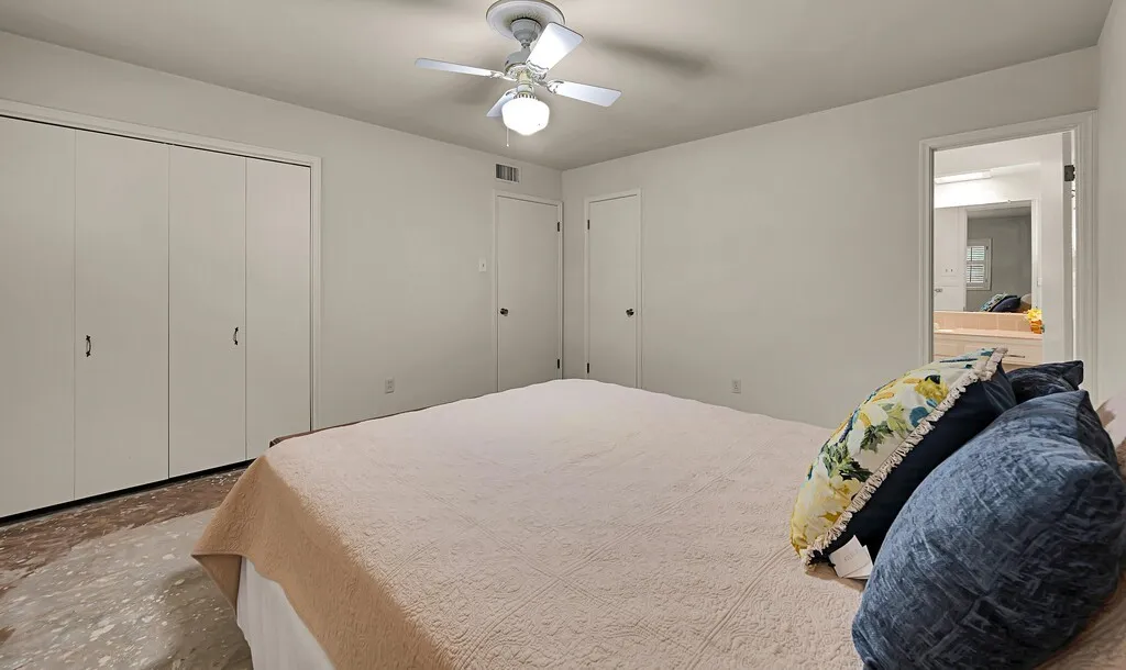Bedroom with a closet and ceiling fan