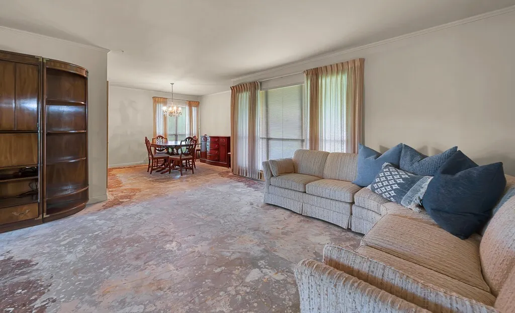 Living room with a chandelier and crown molding