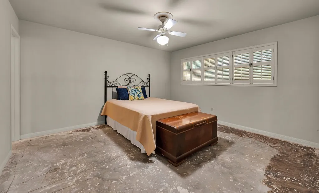 Bedroom featuring baseboards and a ceiling fan