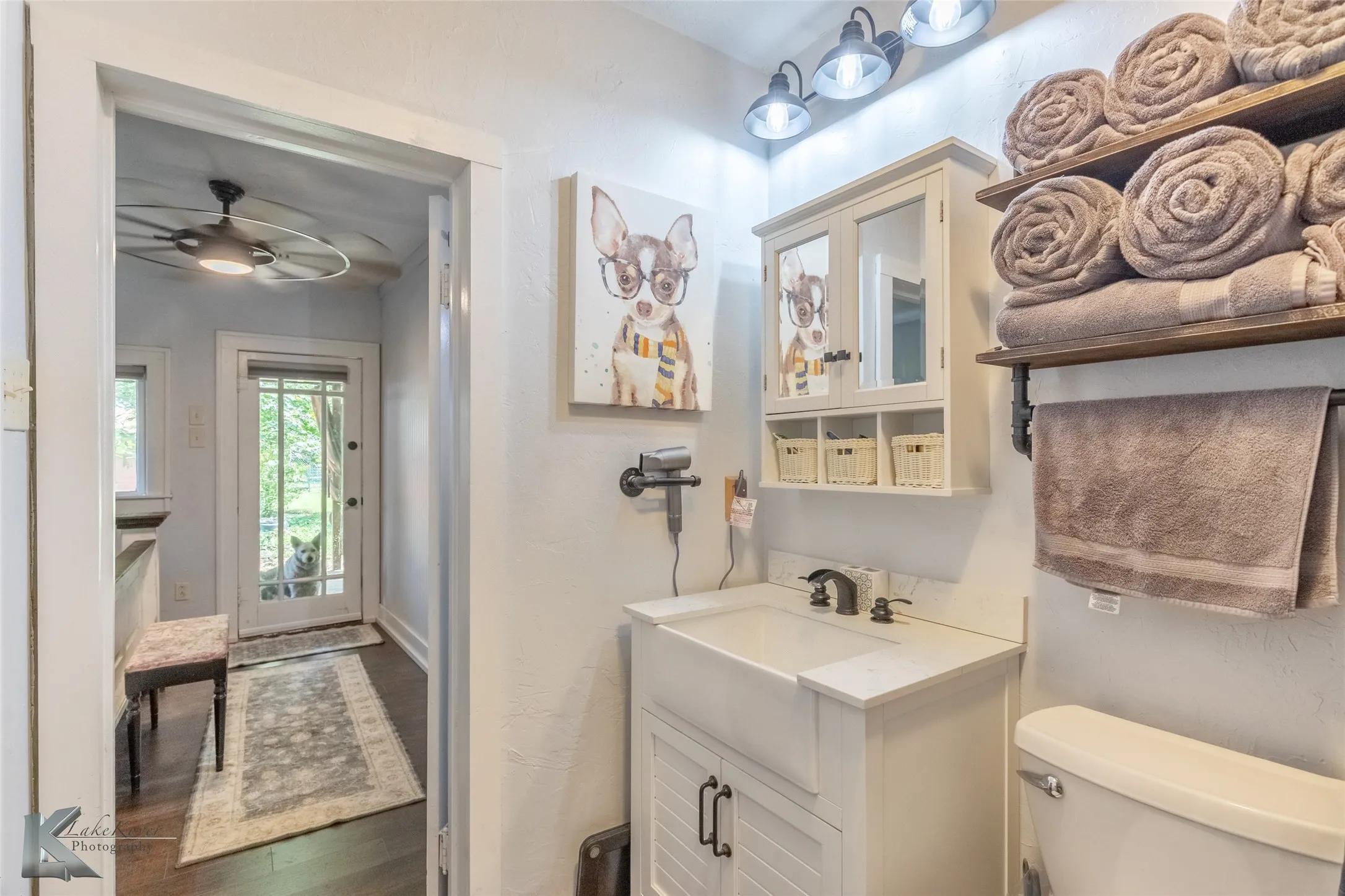 Bathroom, vanity, toilet, and finished floors