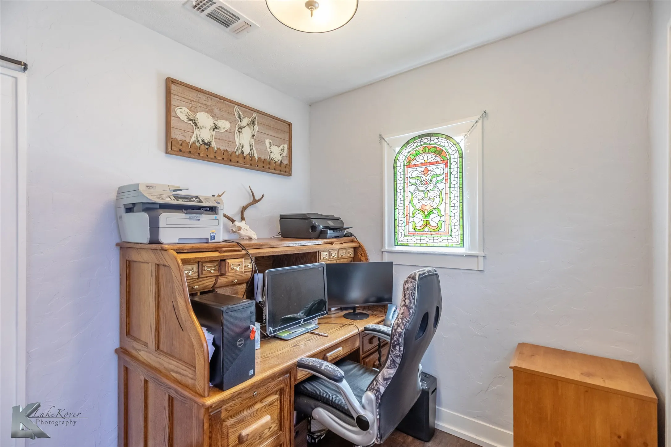 Home office featuring baseboards and wood finished floors