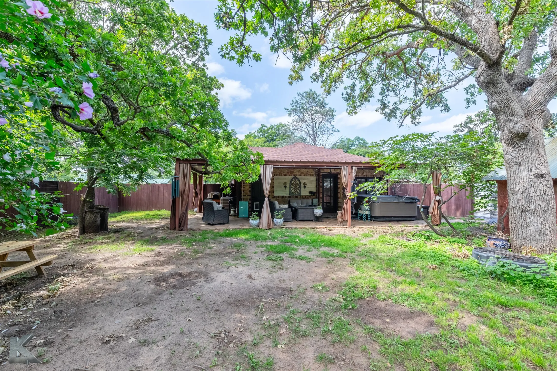 Fenced backyard featuring a outdoor living space, a patio,