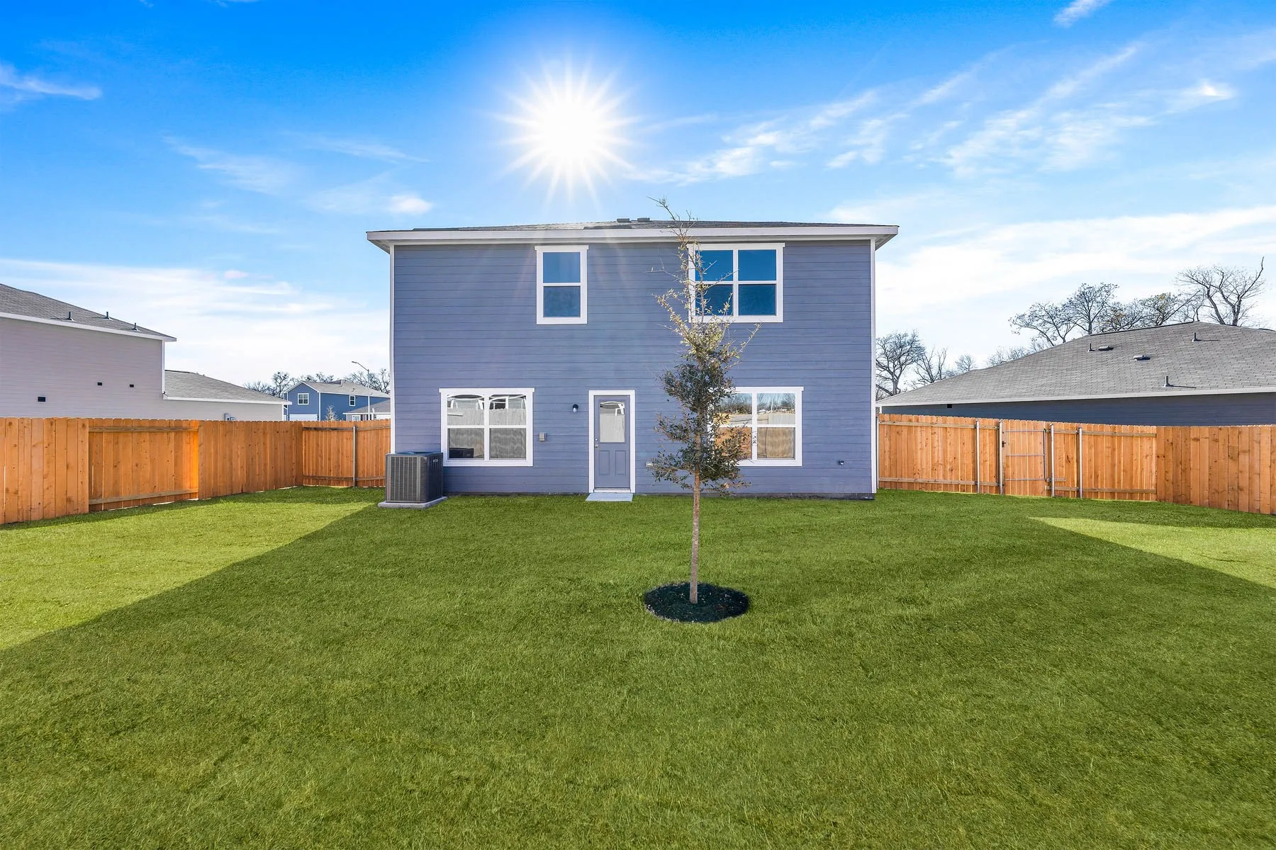 Back of property with central AC