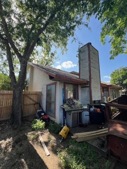 Rear view of property with a chimney