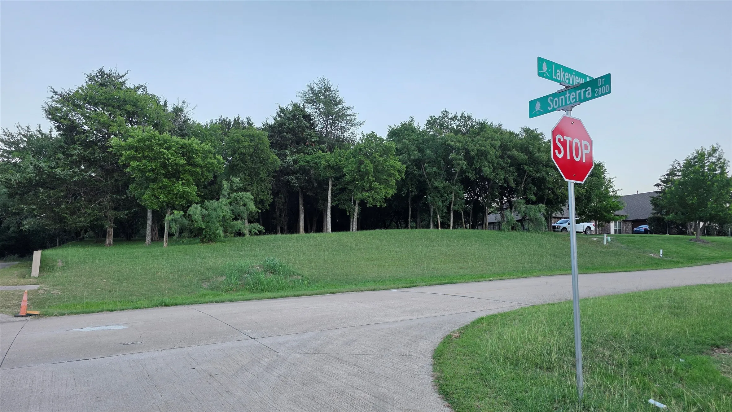 View of home's community with a yard