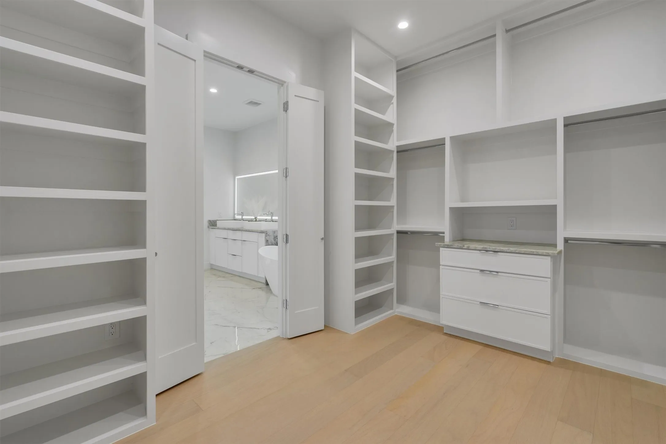 Walk in closet featuring light wood-type flooring