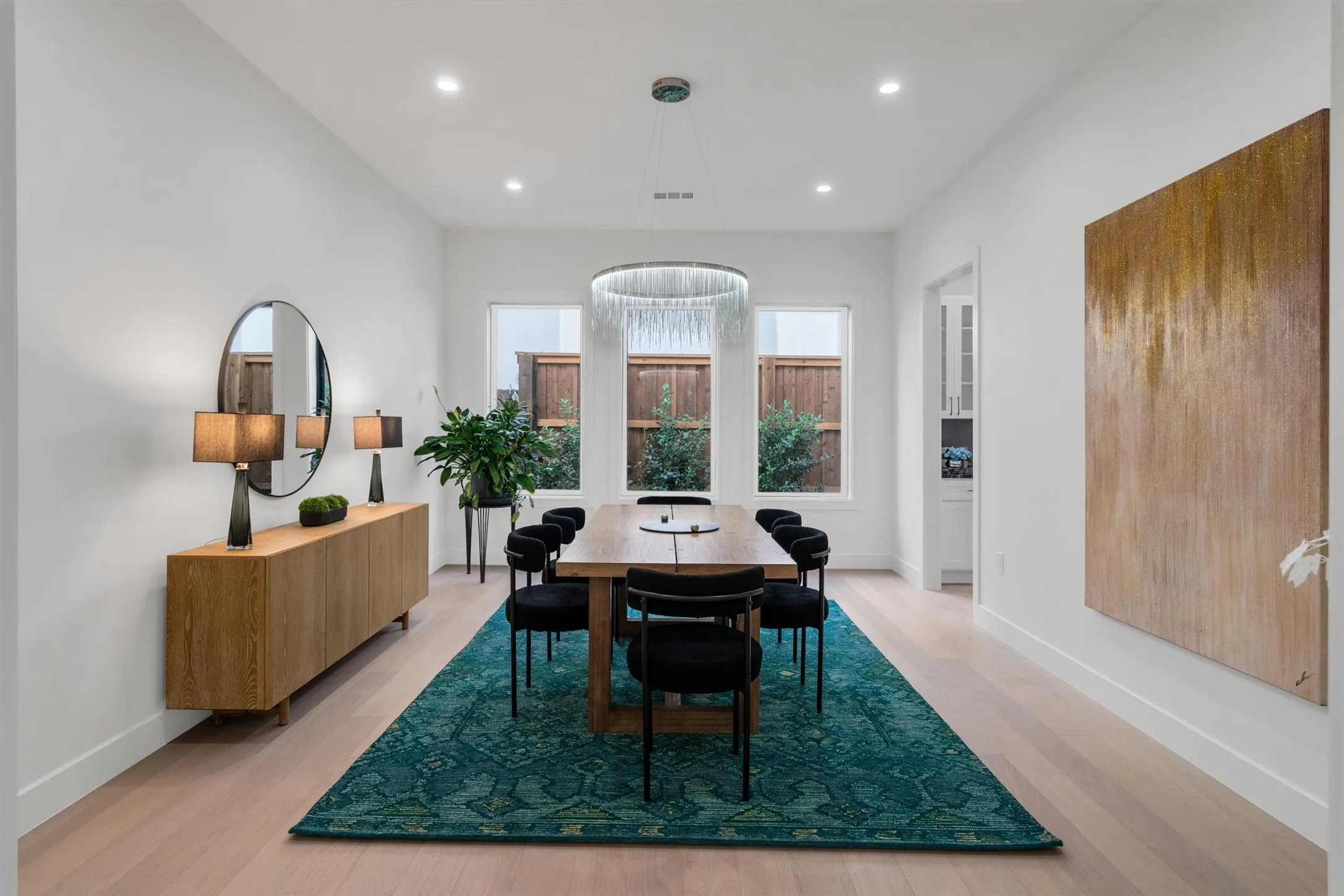 Dining room with recessed lighting, light wood finished floors, and baseboards