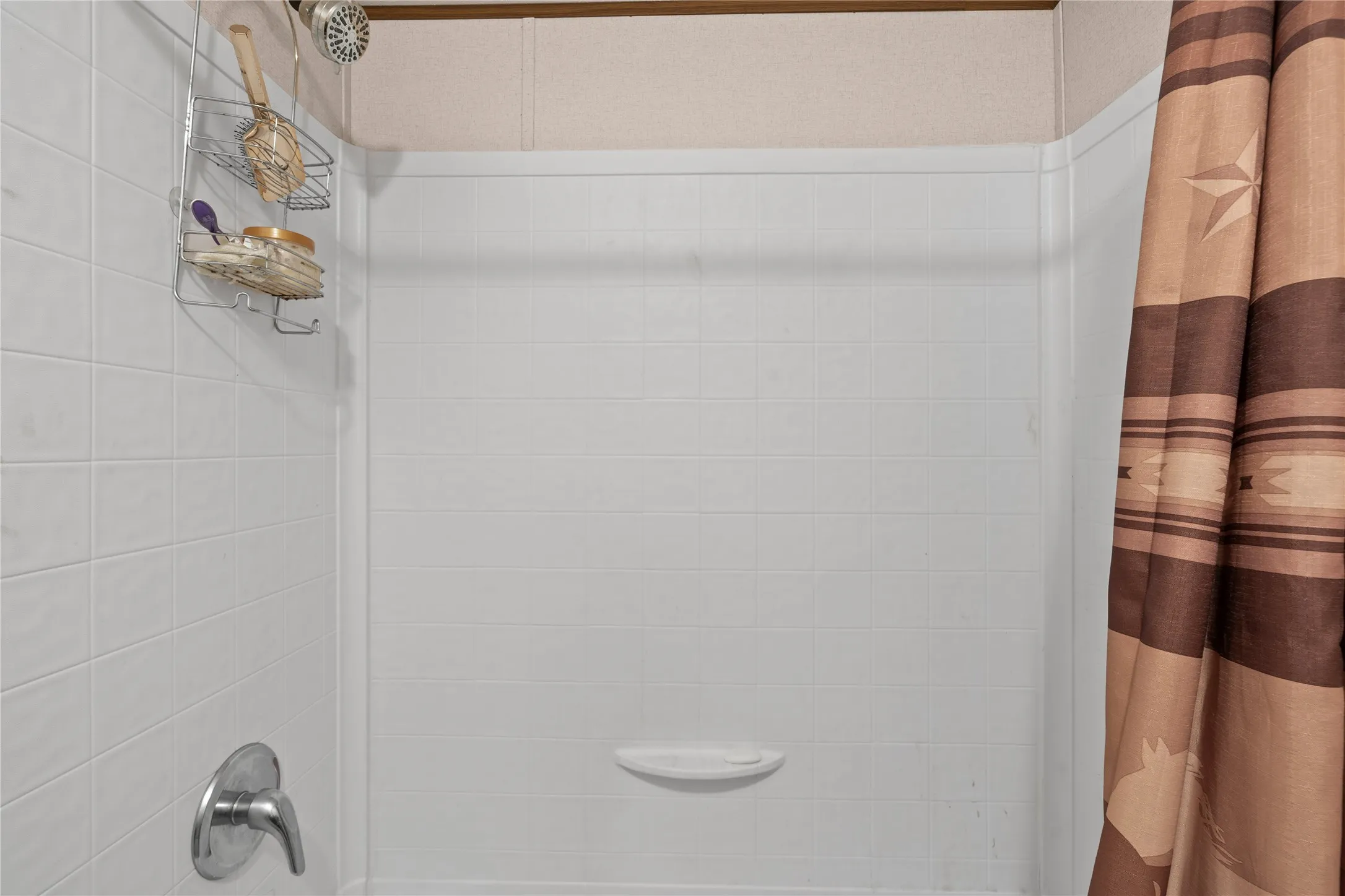 Bathroom with shower / bath combination with curtain