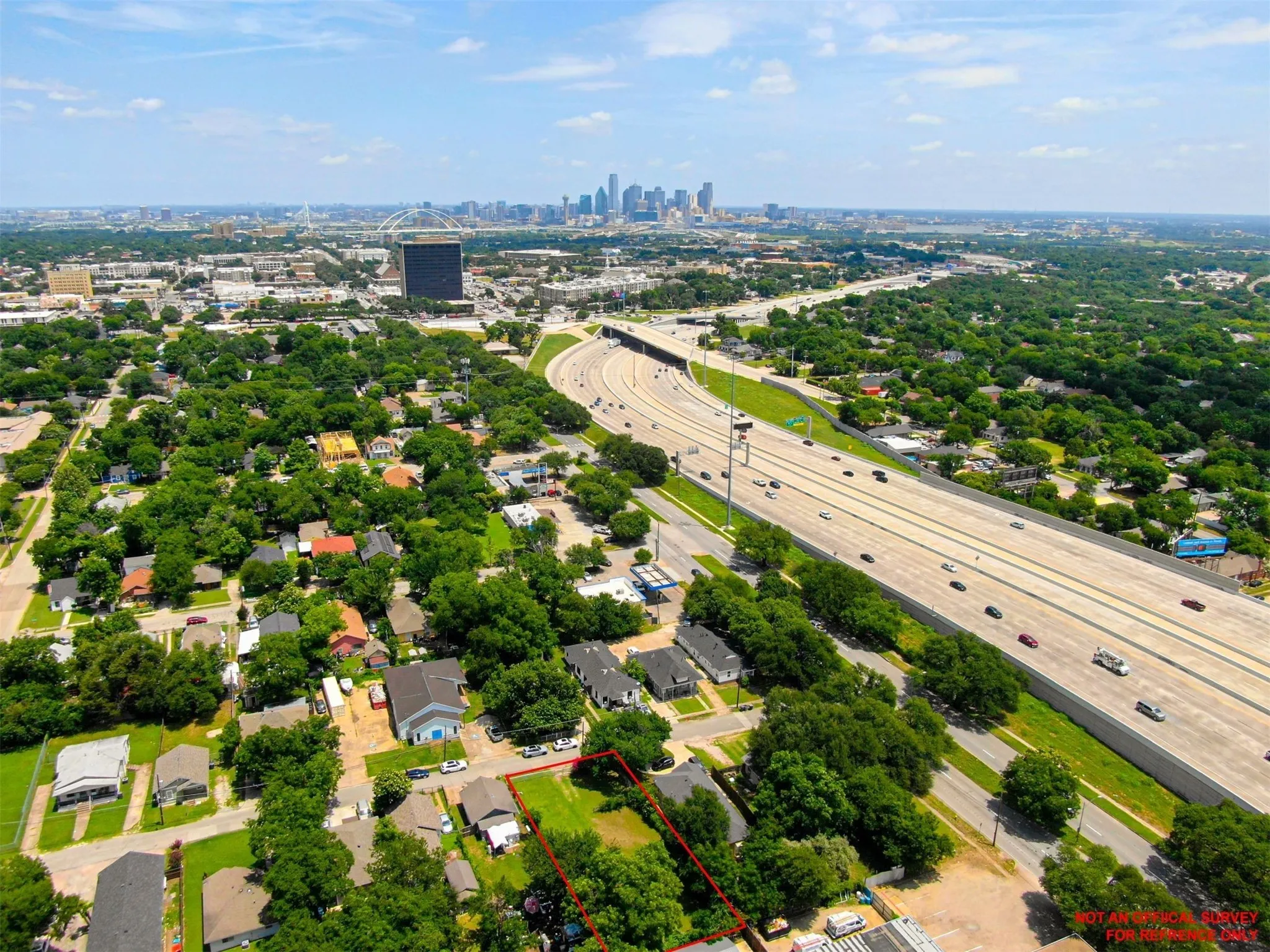 View of urban area featuring a main thoroughfare and property parcel outlined