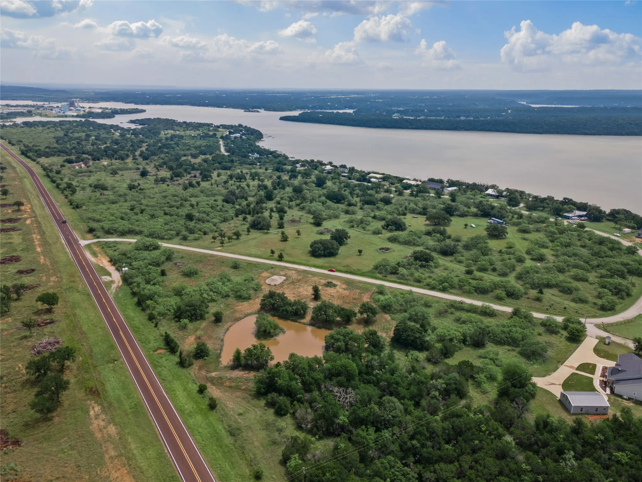 Aerial overview of property's location featuring a nearby body of water