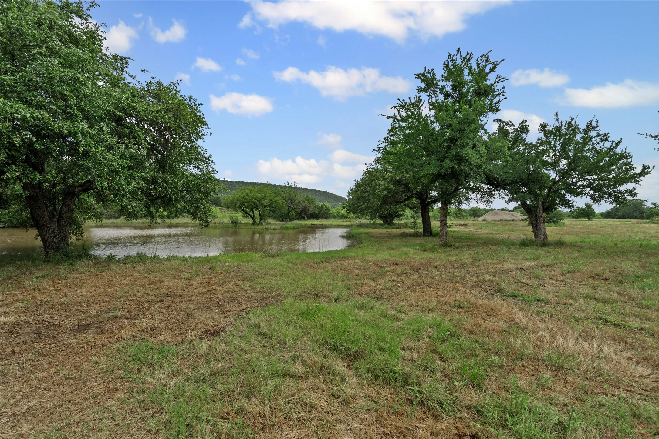 View of yard with a water view