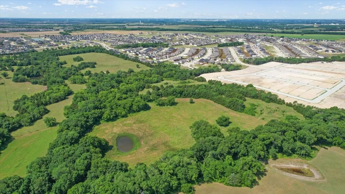 Aerial View of the land at 4195 CR 1001 that butts up against the Subdivision - Eastridges New Phase.