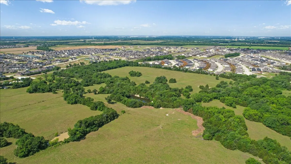 Aerial View of the land at 4195 CR 1001 that butts up against the Eastridge Subdivision.