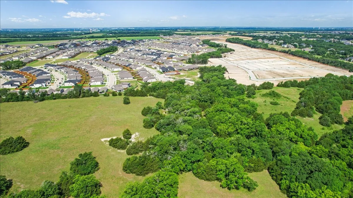 Aerial View of the land at 4195 CR 1001 that butts up against the Subdivision - Eastridges New Phase.