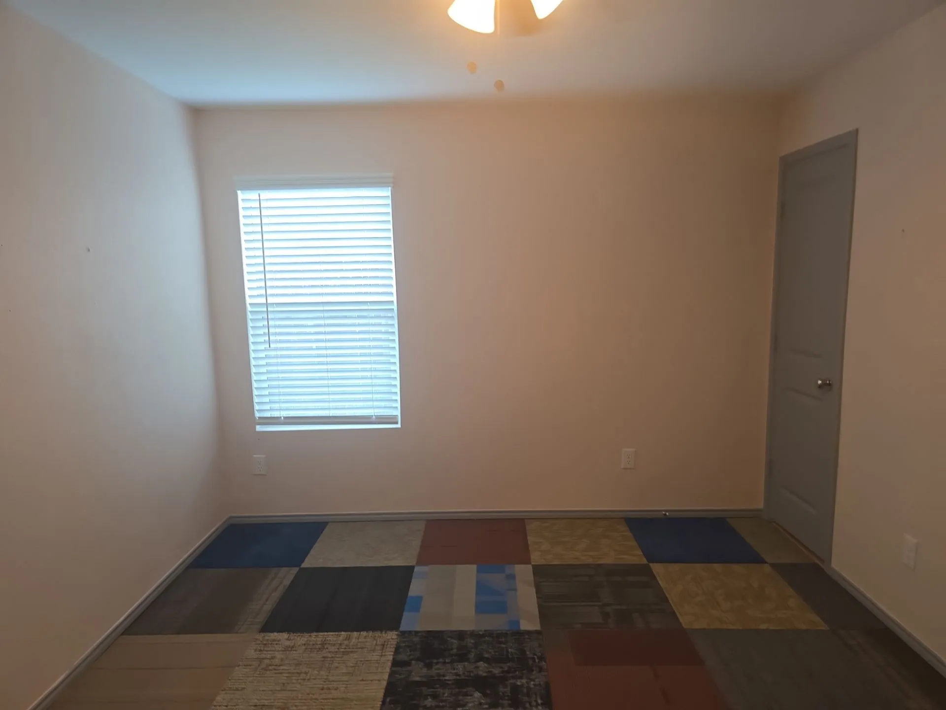 Spare room featuring plenty of natural light and a ceiling fan