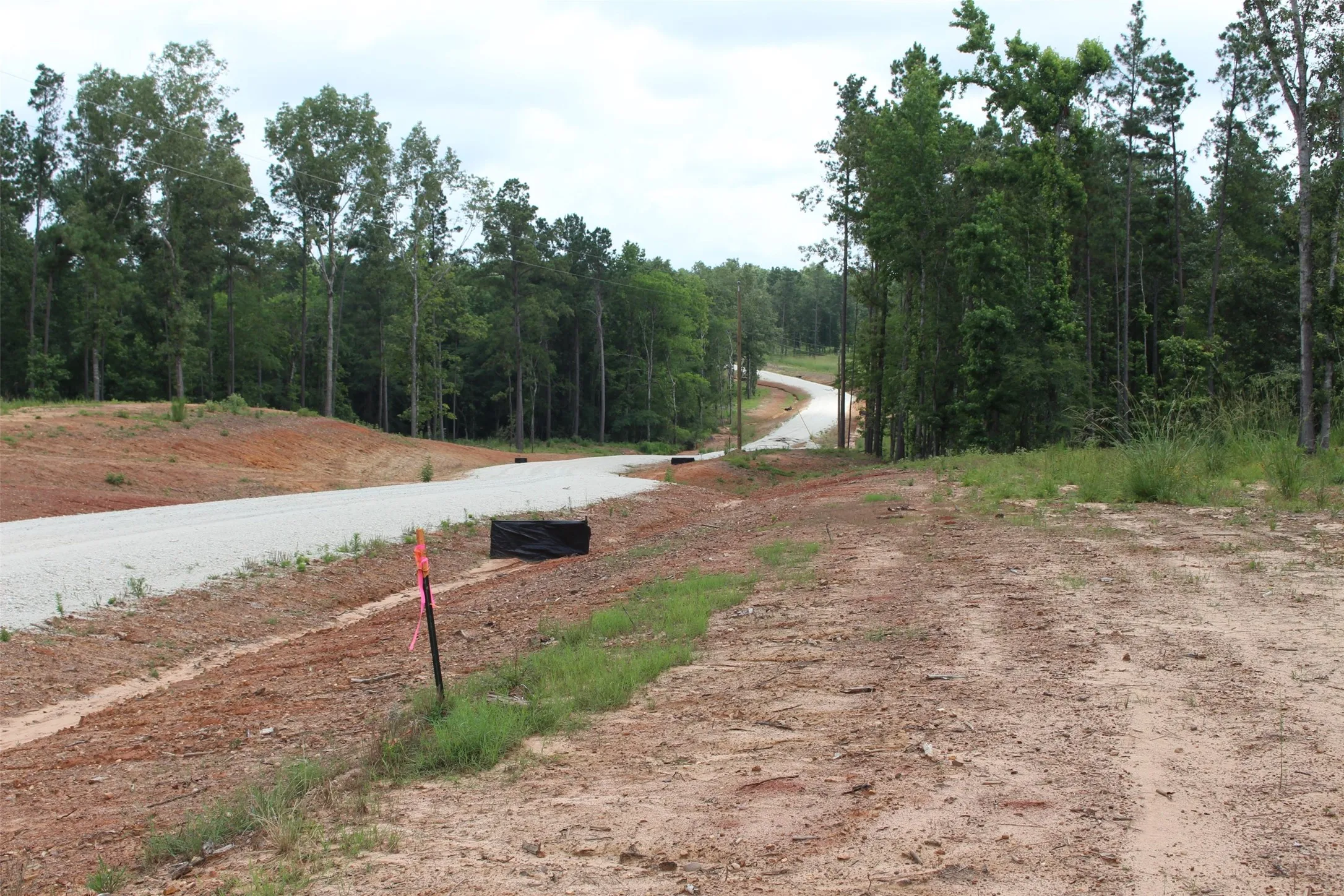 This view is taken from the subject tract. As you can see you are at the top of the hill. The survey stake is the left side property boundary if the tract.