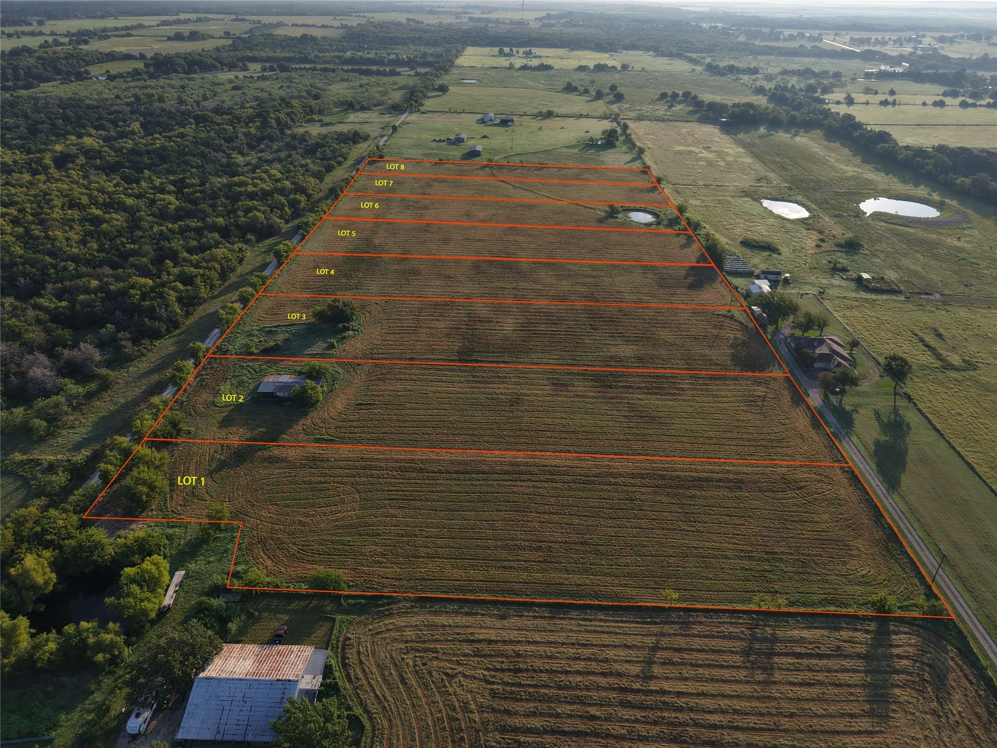Overview of rural landscape with property parcel outlined and farmland